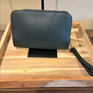Louis Vuitton Baikal clutch bag made from green Taiga